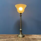 Ornate brass table lamp with mint green glass shade