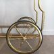Neo-classical table in gilded metal and glass