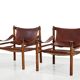 Deux fauteuils Arne Norell Sirocco en palissandre et cuir.