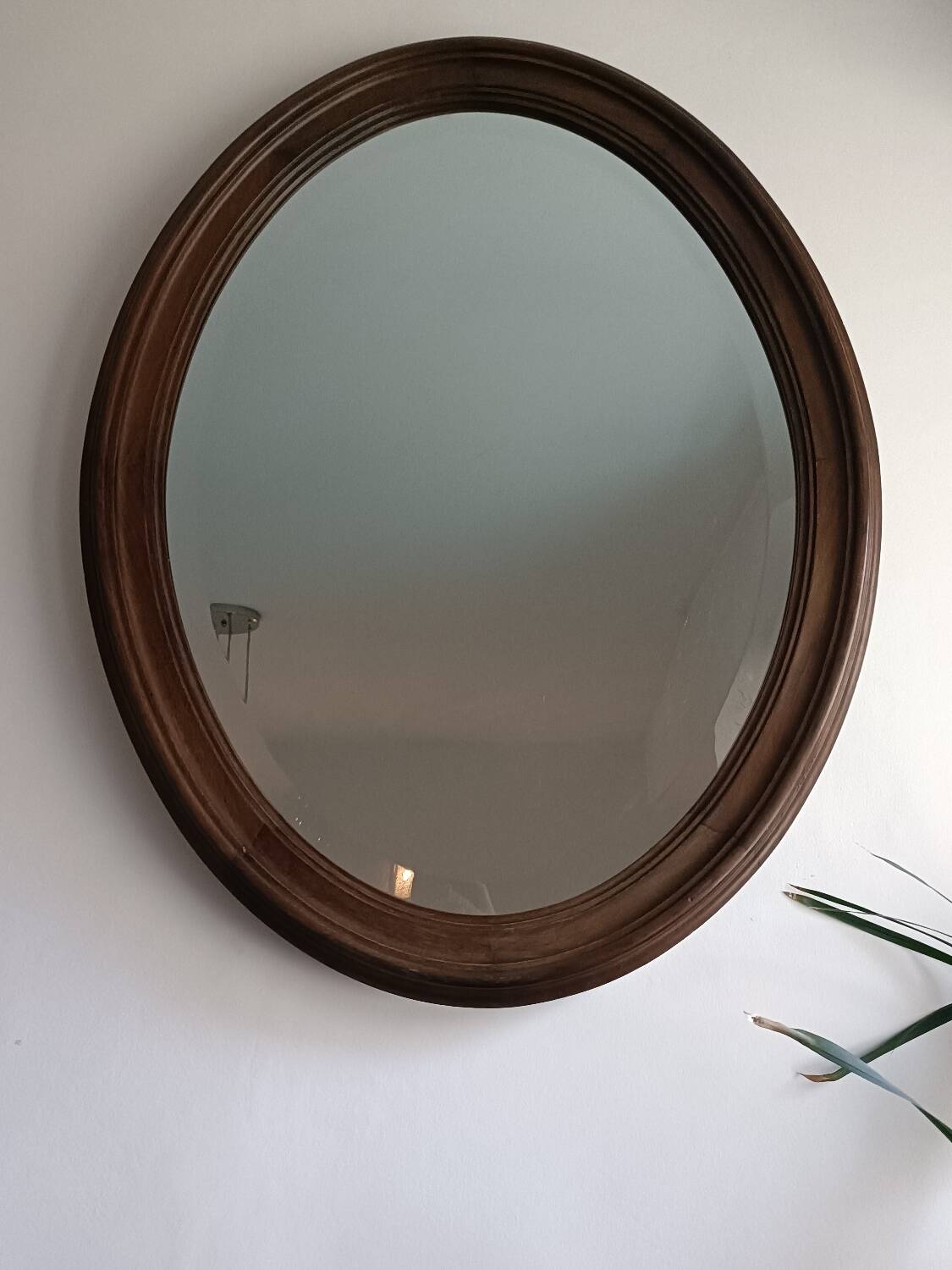 Antique oval beveled mirror