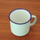 Green enamelled mug of water