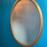 Vintage beveled gold oval mirror