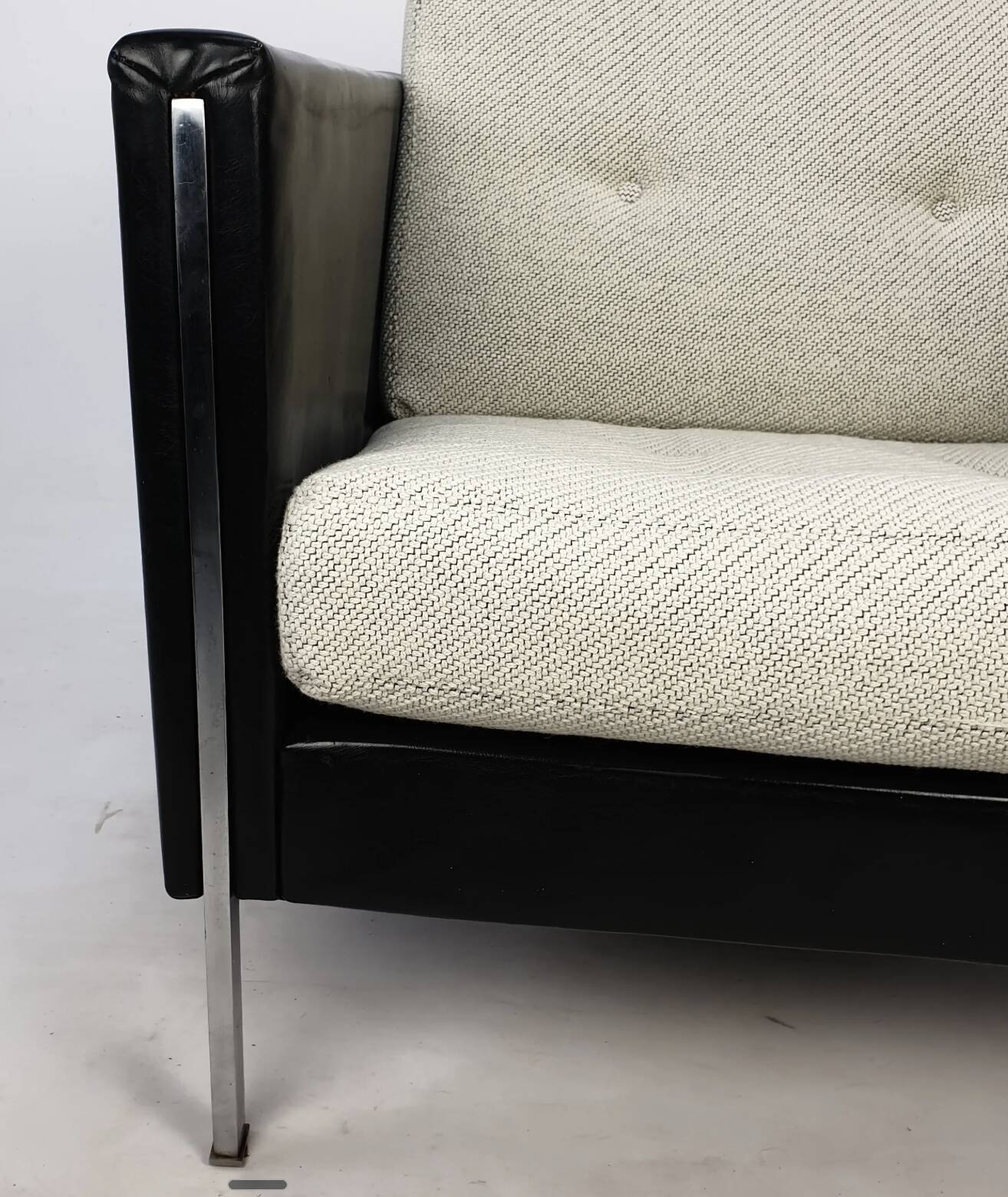 Pair of armchairs by Pierre Paulin for Artifort, black leather and cream fabric.
