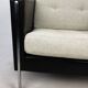 Pair of armchairs by Pierre Paulin for Artifort, black leather and cream fabric.