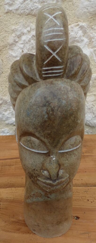African woman sculpture in stone