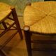 Pair of beech stools with straw seats