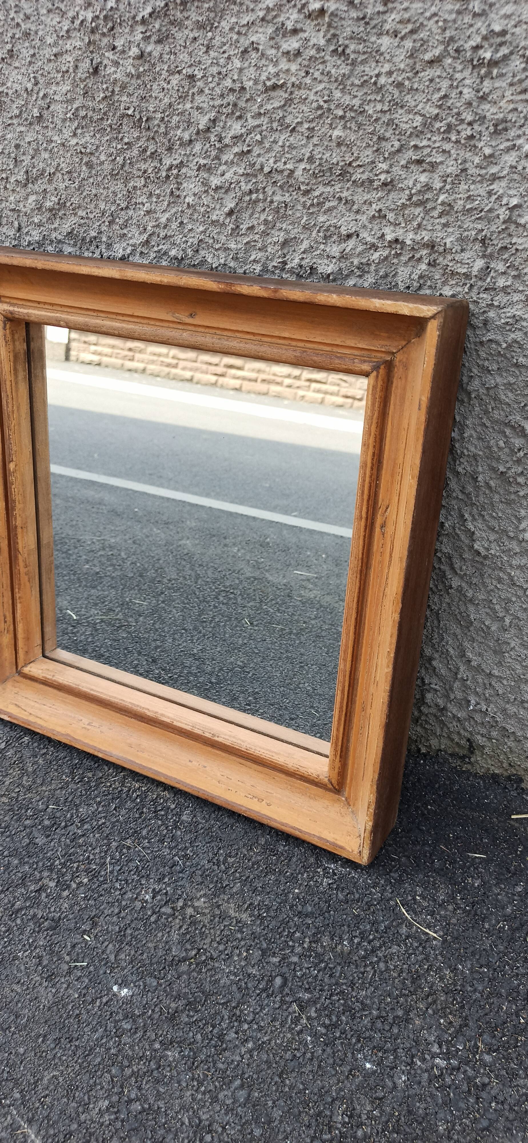 Square mirror in old wood