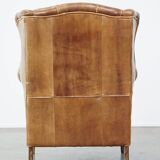 Graceful, stylish, timeless and comfortable wing chair made of cowhide in English style