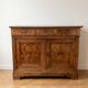 Antique walnut sideboard from the period.