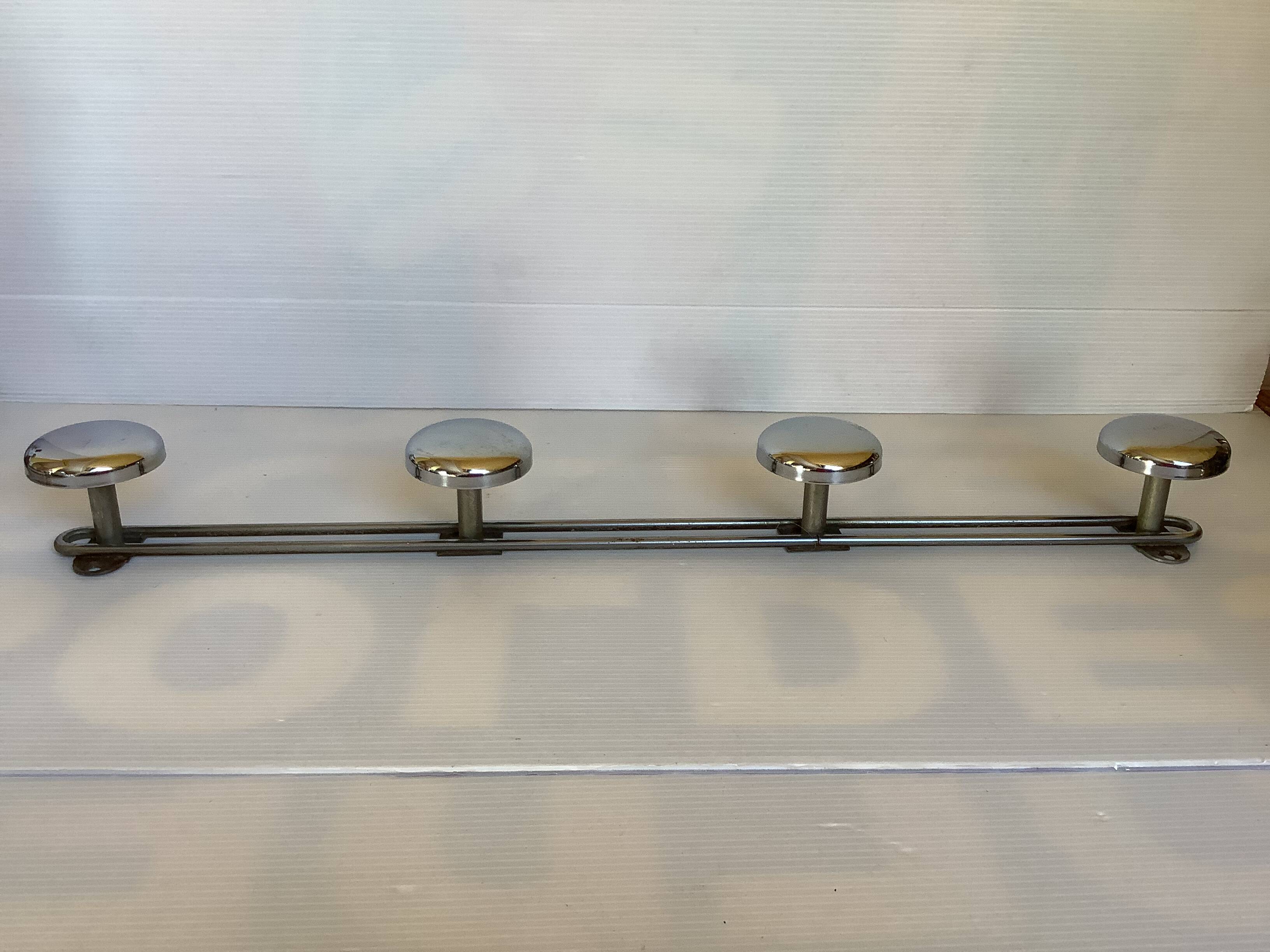 Chromed metal coat rack with four hooks