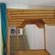 Storage column, wooden bookshelf and woven rattan.