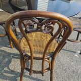Rattan dining table and its 4 matching chairs