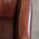 Set of 2 sheepskin club armchairs in a dark cognac colour