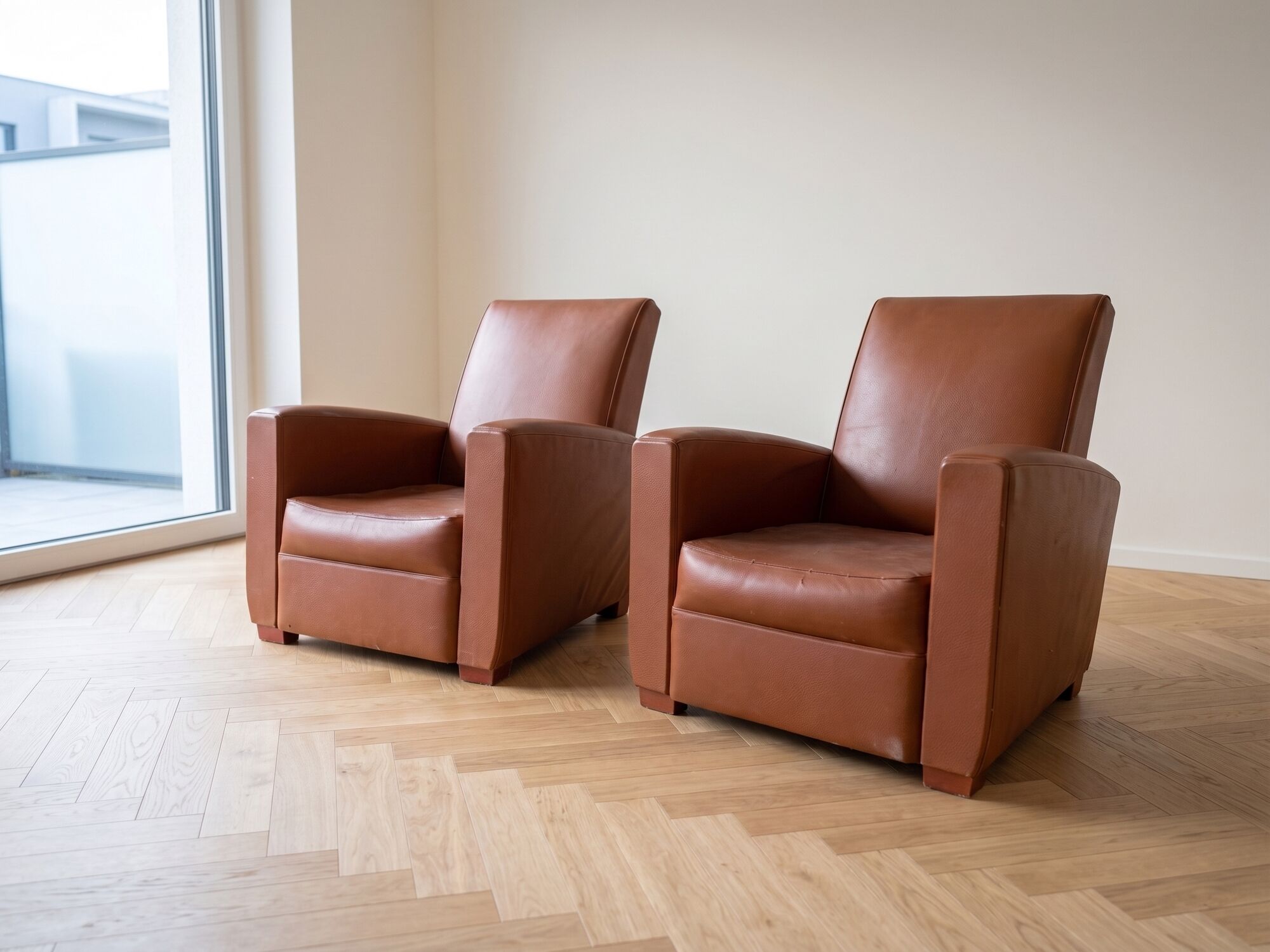 Pair of vintage brown leather club chairs