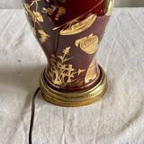 Vintage 1970 red and gold ceramic lamp with oriental decorations.