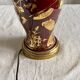 Vintage 1970 red and gold ceramic lamp with oriental decorations.