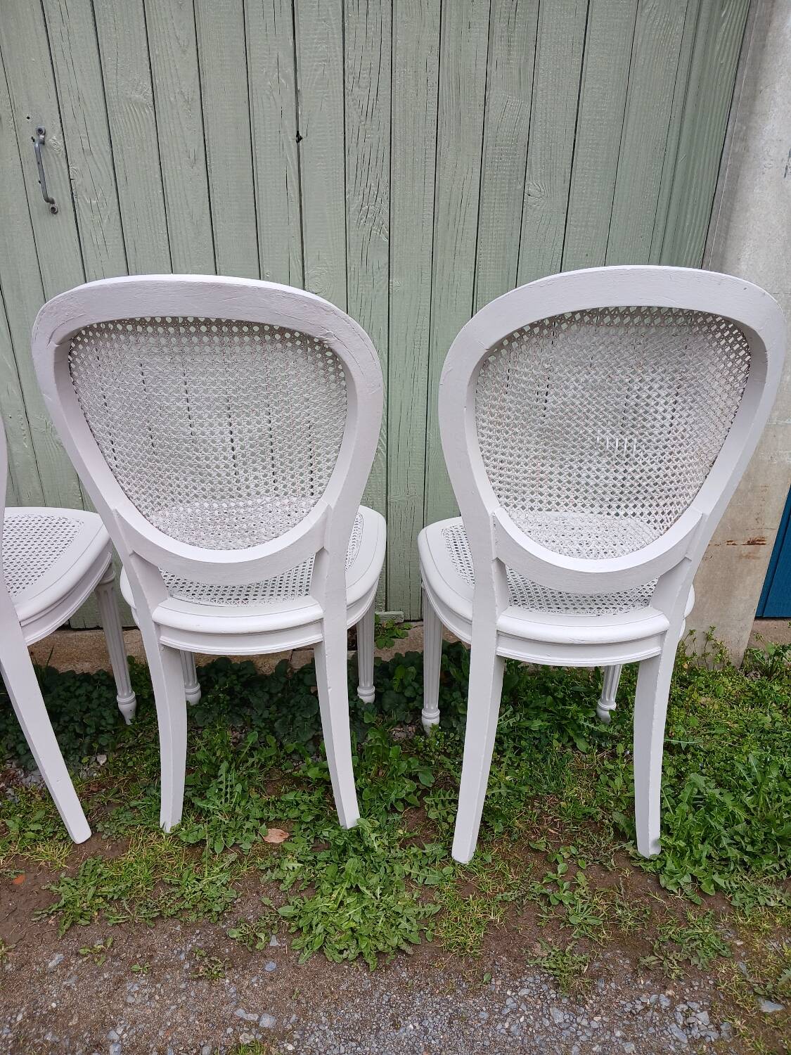 4 old wooden and cane chairs