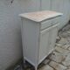 Small buffet, reimagined storage unit in beige.