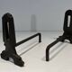 Pair of Modernist Andirons in Cast Iron with Openwork Uprights and Tripod Bases