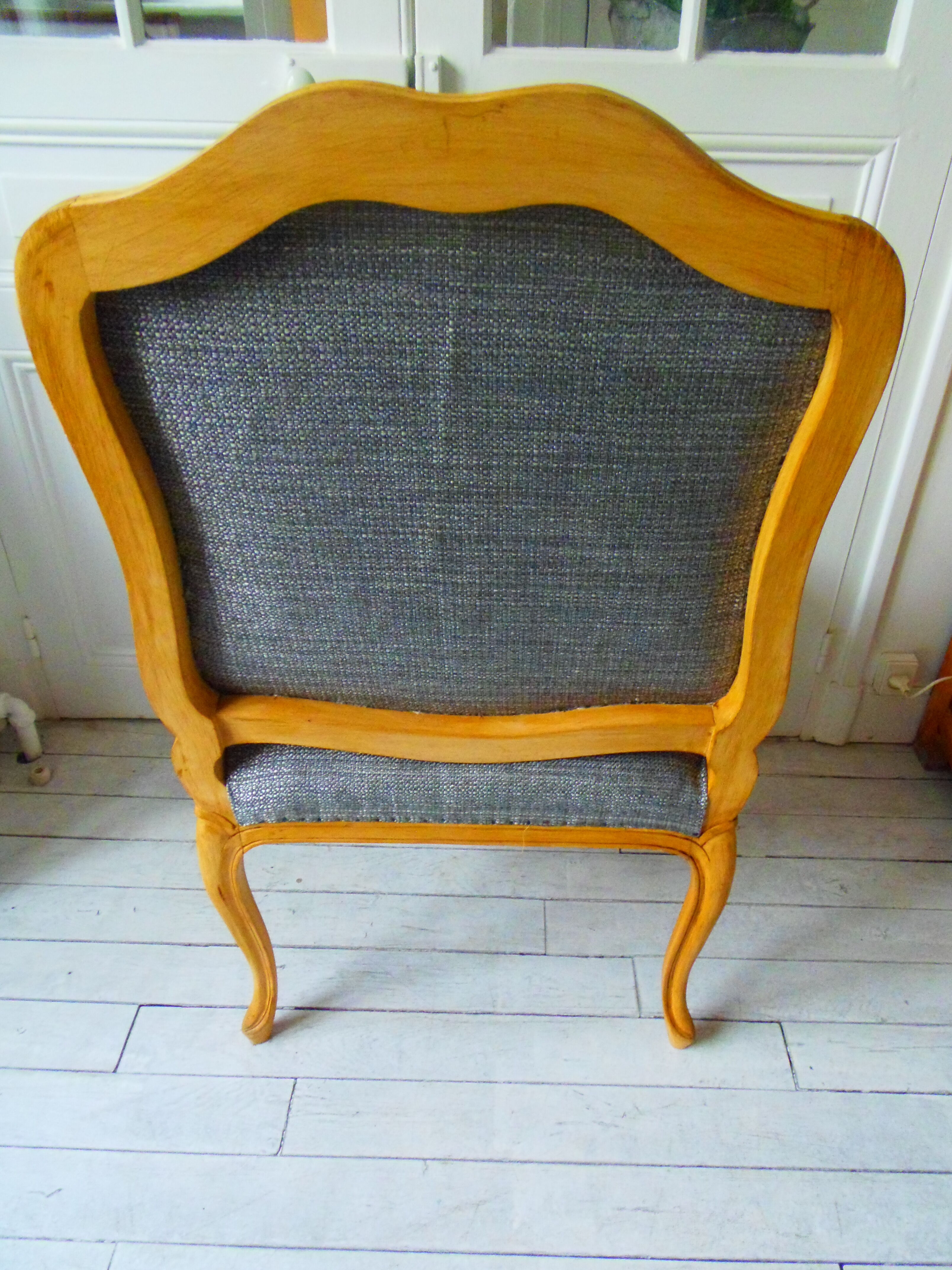 Louis XV style chair trim lined with a mottled grey wool, medium oak waxed finish