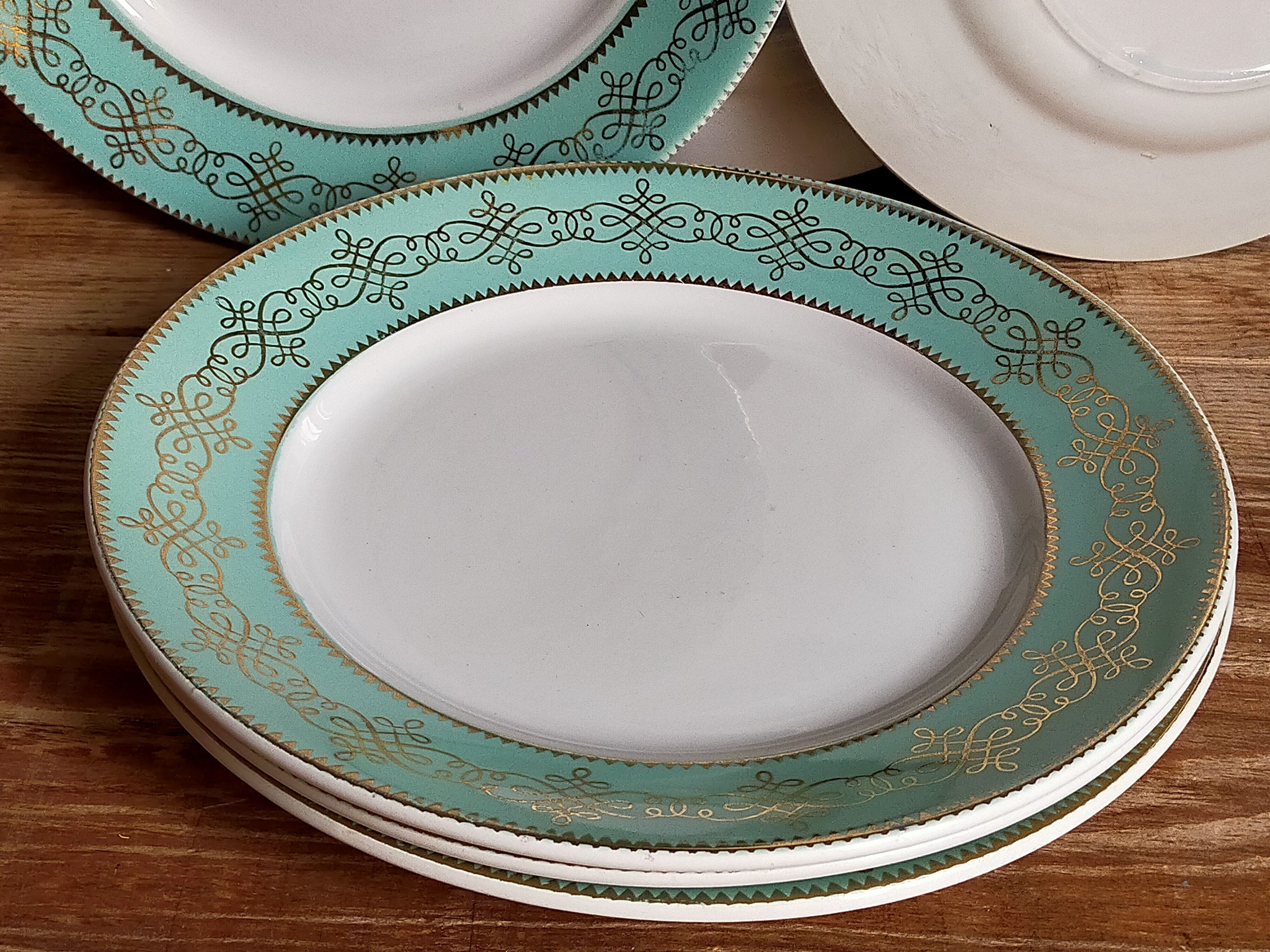 Six plates of vintage Badonviller earthenware with gold frieze