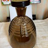 Brown glass decanter with its cap