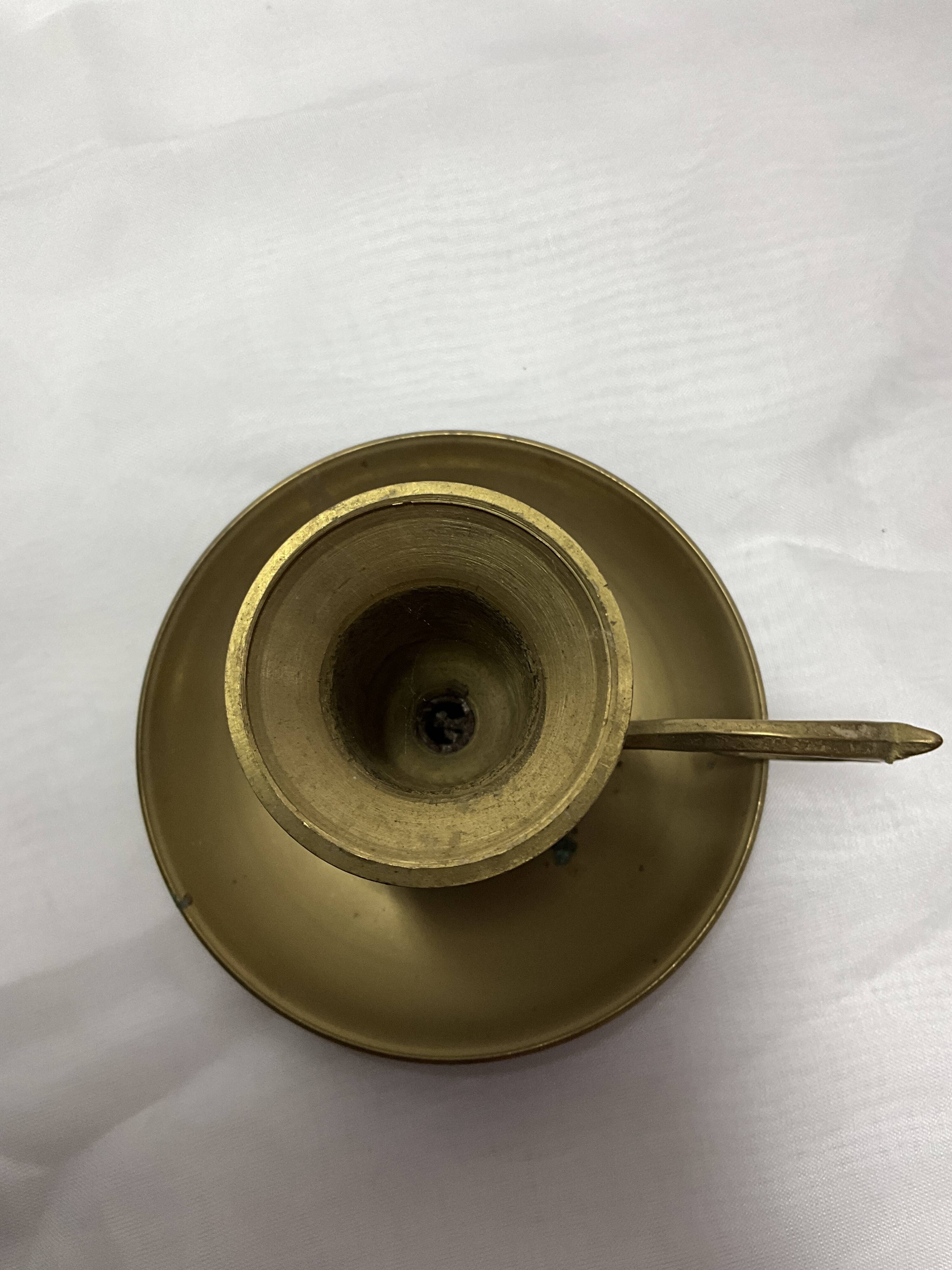 Brass hand candle holder