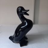 Duck statuette in black ceramic.