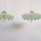 Pair of green opaline glass pendant lights – frosted poetry & Art Deco brilliance