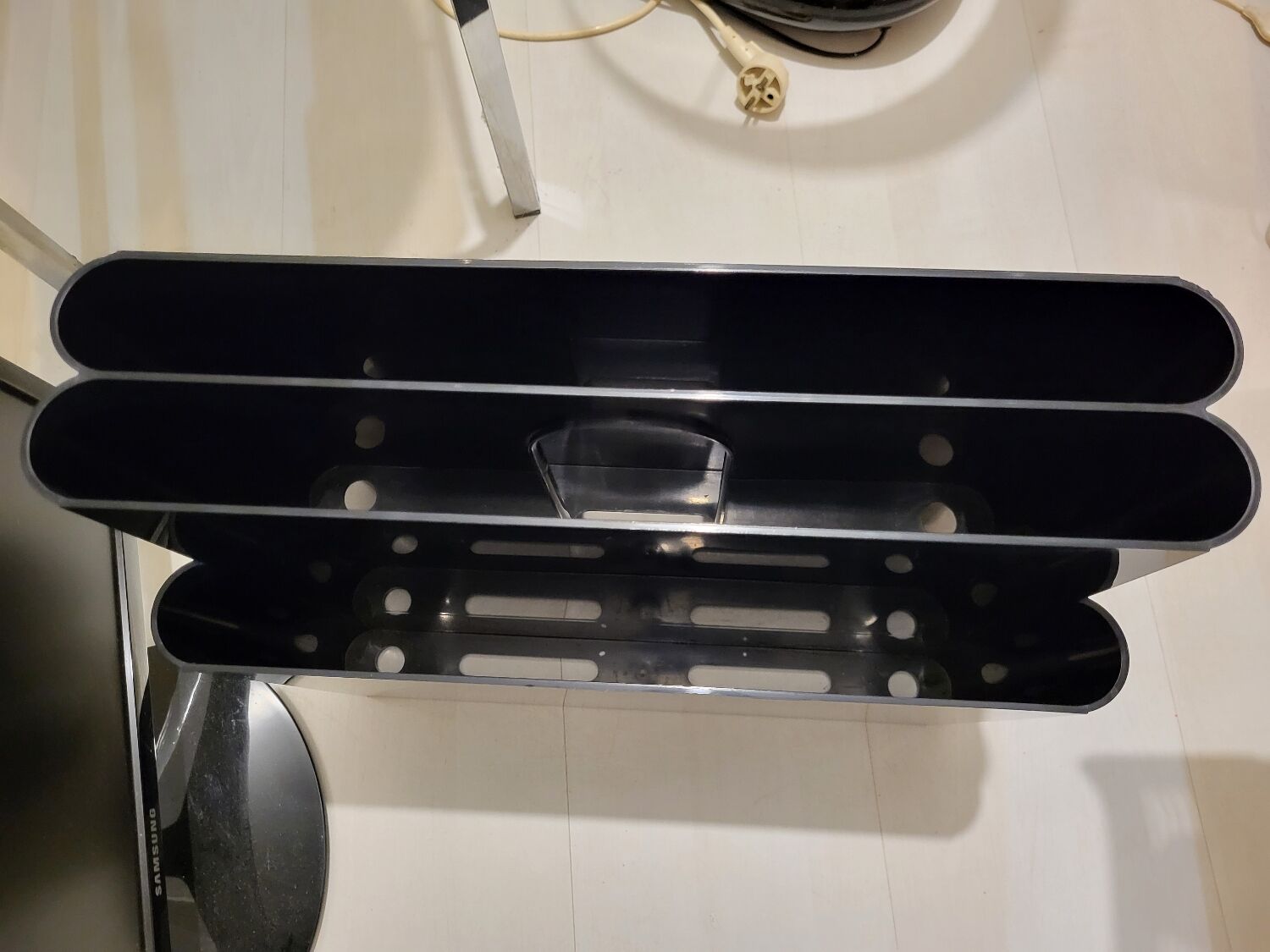 Kartell black magazine rack