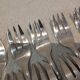 11 silver-plated cake forks with PP shell decor