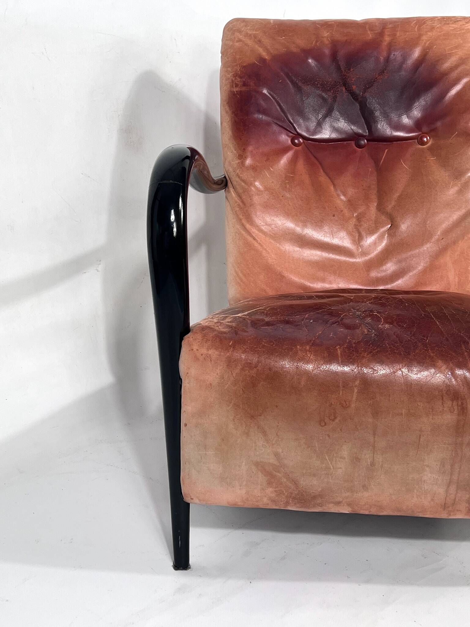 Sculptural Italian Mid-century leather and curved wood armchair from 50s