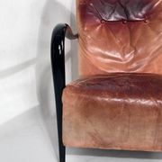 Sculptural Italian Mid-century leather and curved wood armchair from 50s