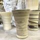 High ceramic cups made of mixed clay.