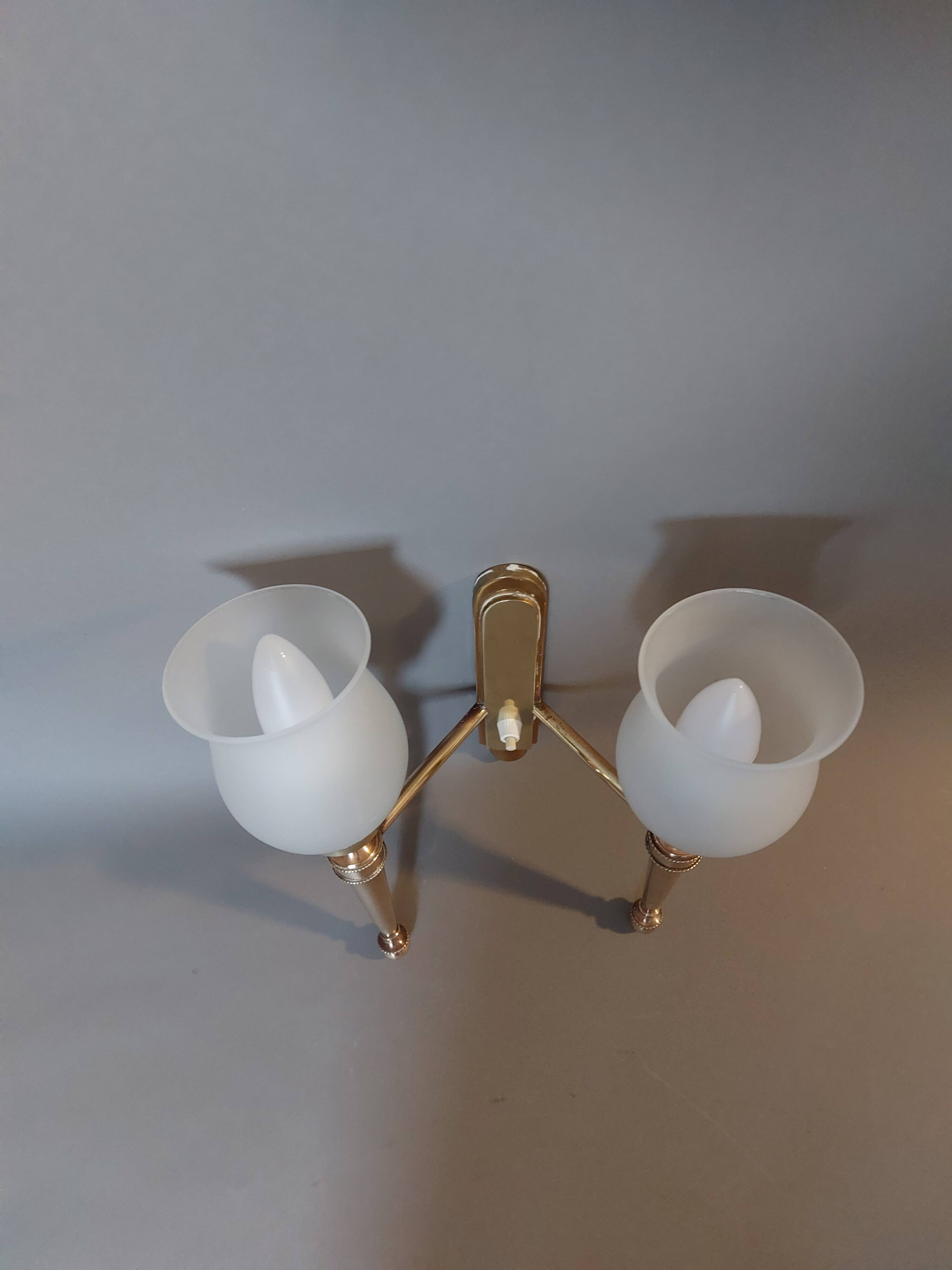 Neoclassical Torch two-arm wall lamp in solid brass, circa 1940