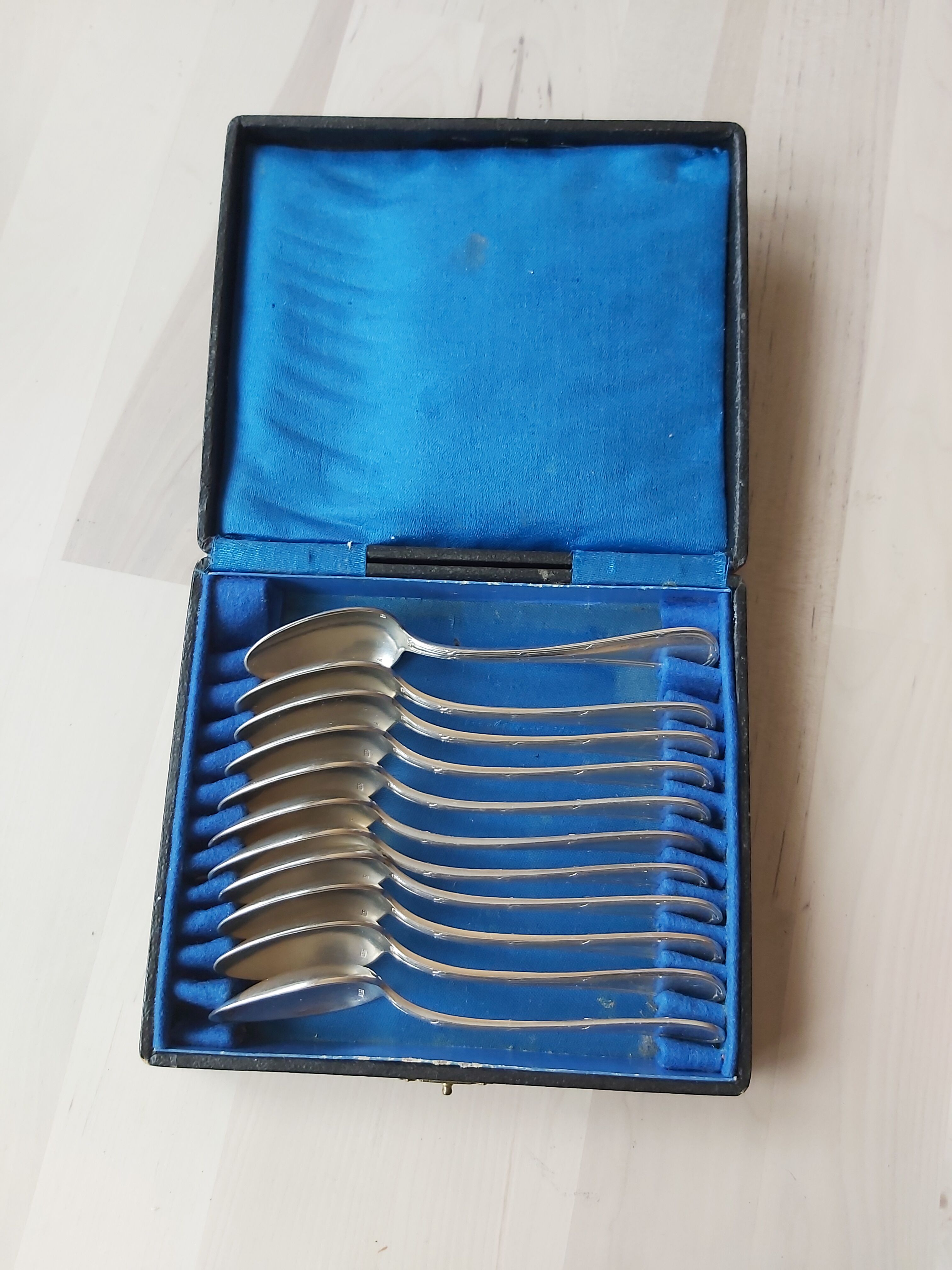 Series of 11 small silver metal spoons