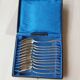 Series of 11 small silver metal spoons