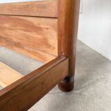 Brutalist style bed with chain and straw