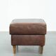 Sturdy vintage sheepskin ottoman in a beautiful large size with black piping