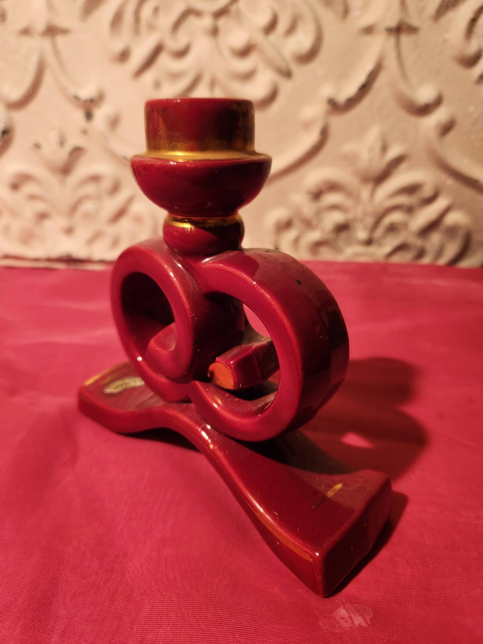 Pair of vintage ceramic candle holders, hand-painted in red and gold.