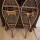 Pair of old snowshoes in wood, leather, and natural gut string