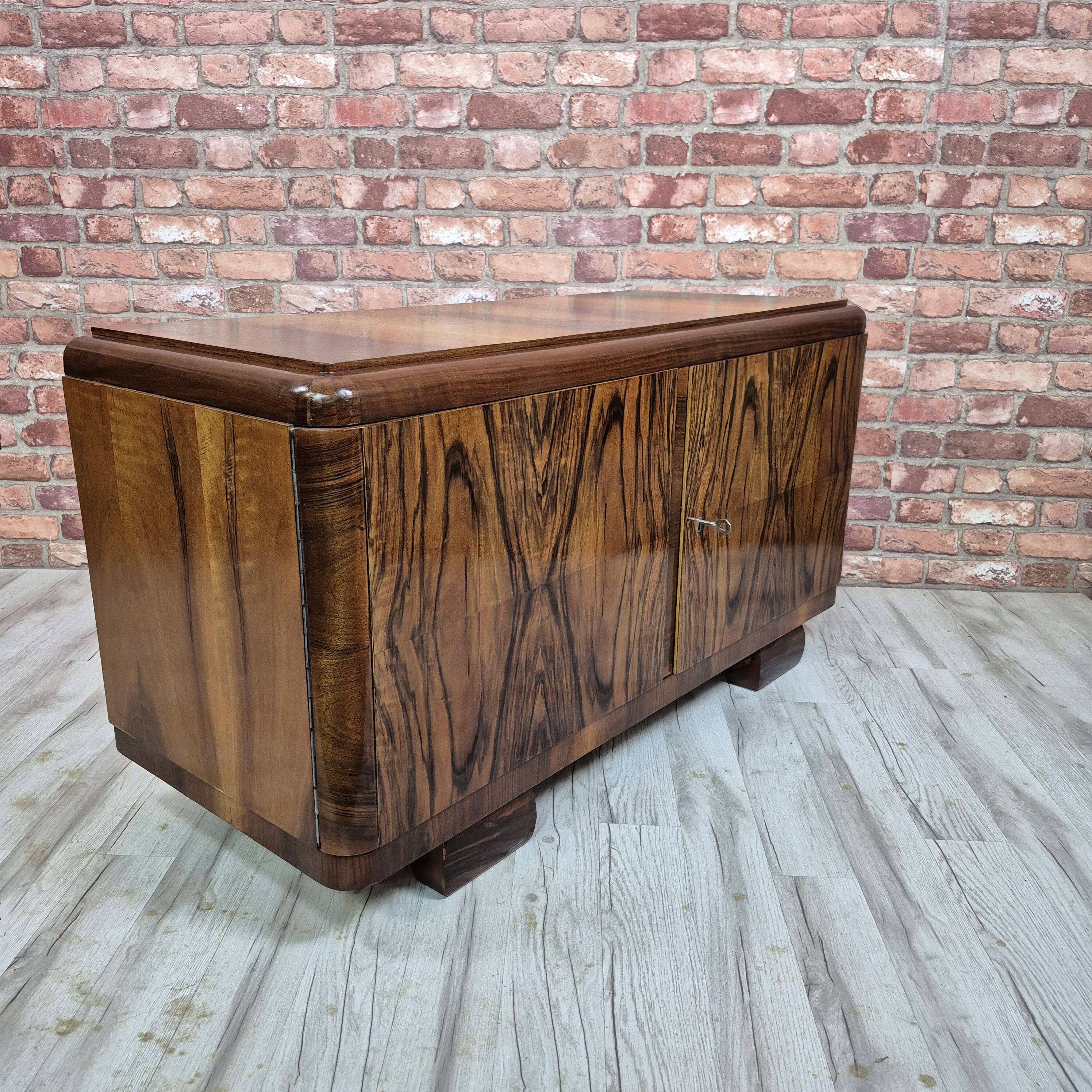 Low sideboard after renovation. Hypnotising veneer and Art Deco style.