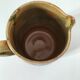 Glazed earthenware jug