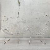 Pair of armchairs in white patinated mesh metal.
