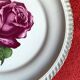 Decorative plate Harker with a red rose in the centre and a 22-carat gold border.