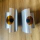 Pair of Space Age wall lights in brushed metal with a copper-orange interior.