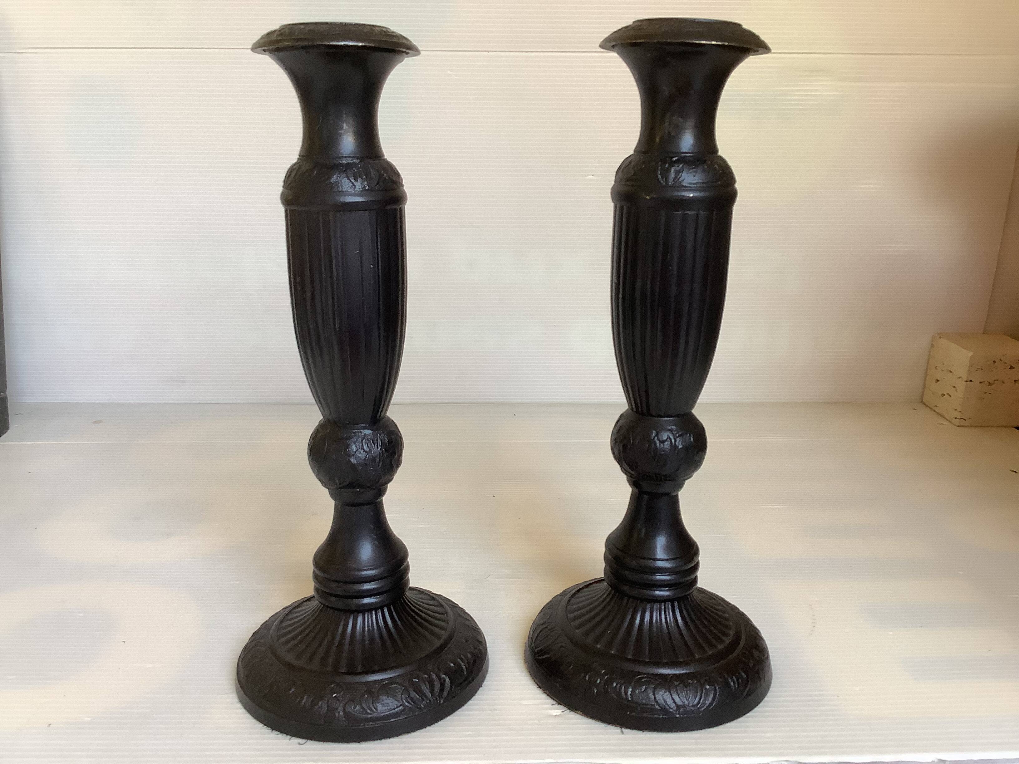 Pair of large black metal candlesticks
