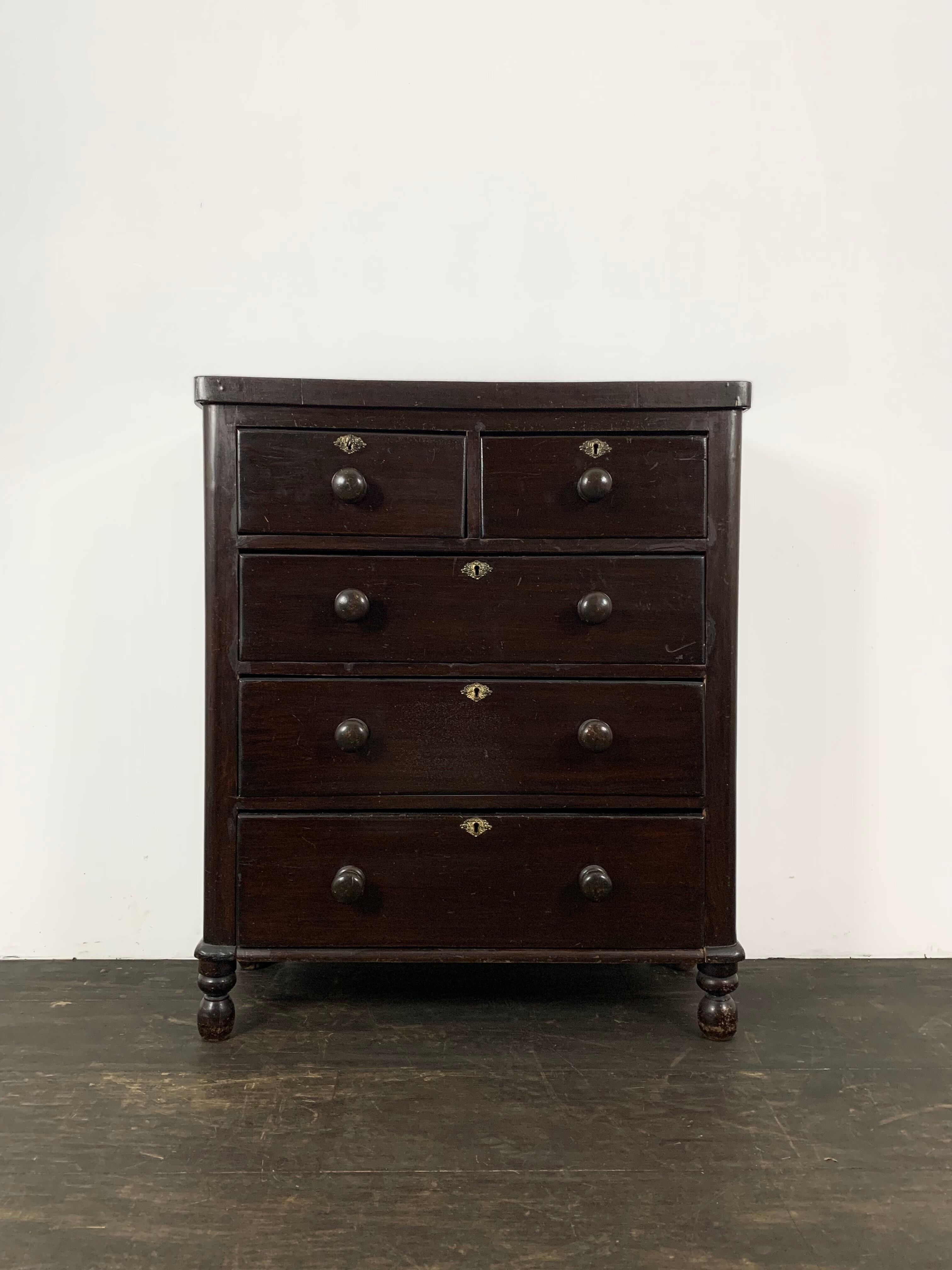 Dark antique chest of drawers