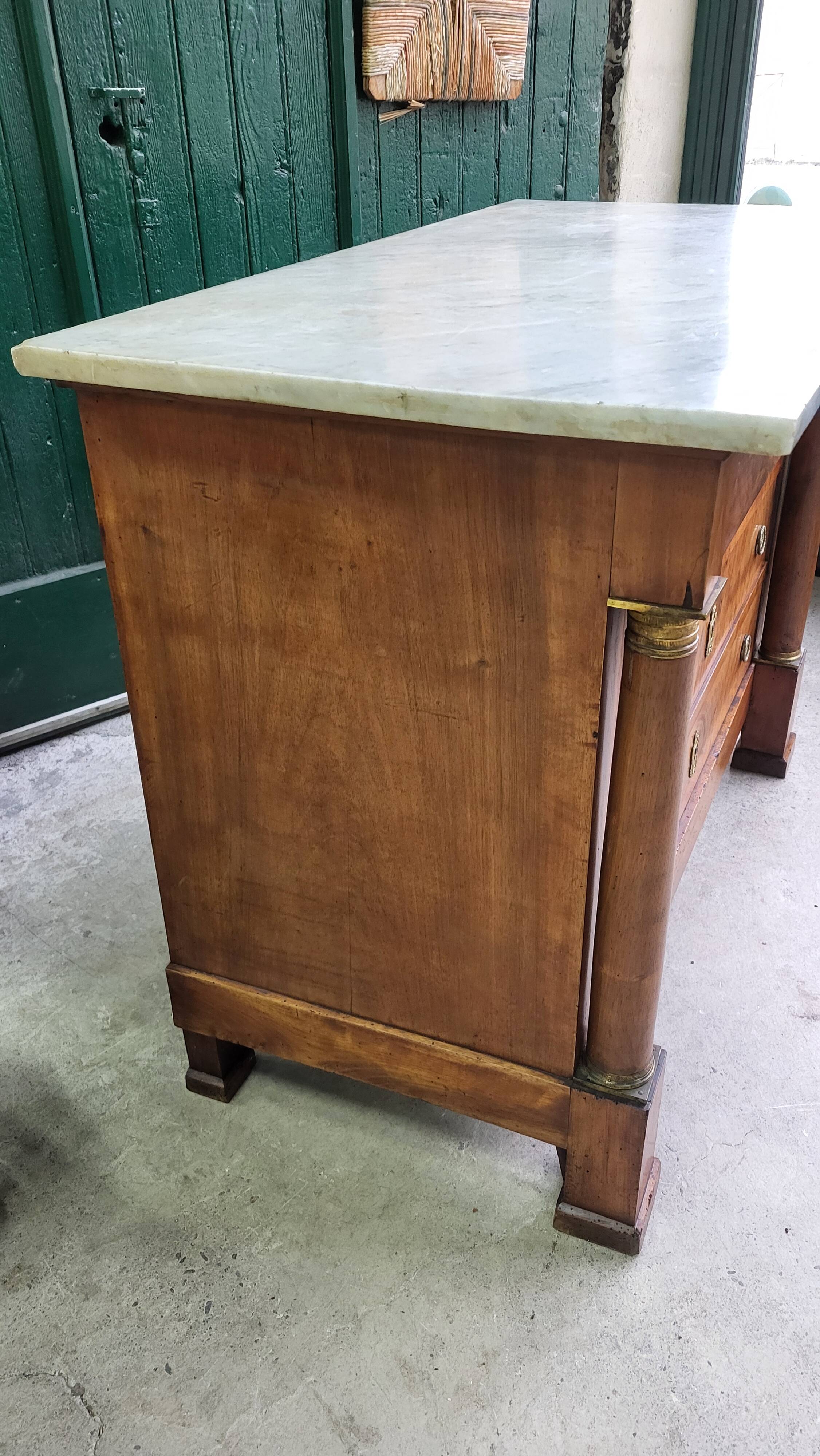 Empire commode in walnut with white marble top from the 19th century