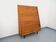 Vintage wooden display bookshelf with drawers from the 1960s.